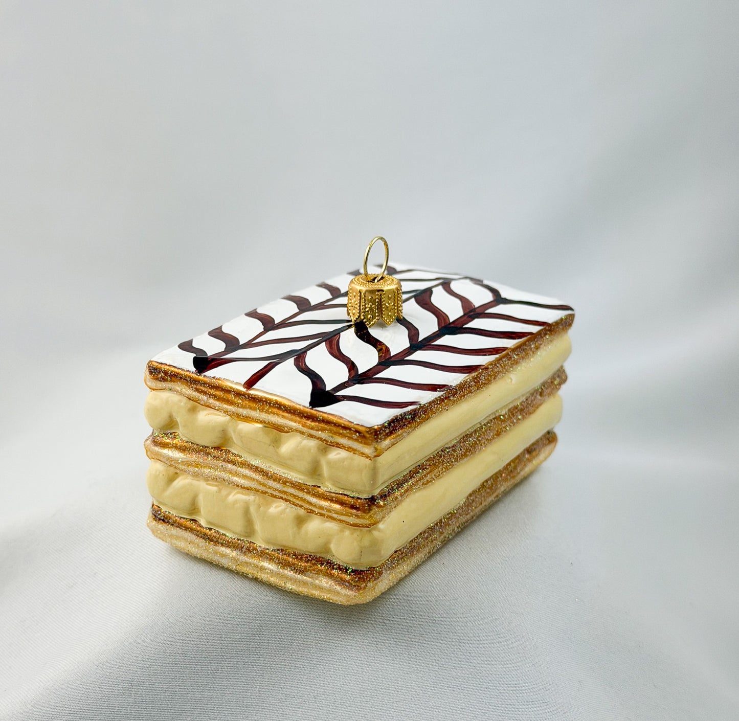 Cream slice with icing and chocolate decoration