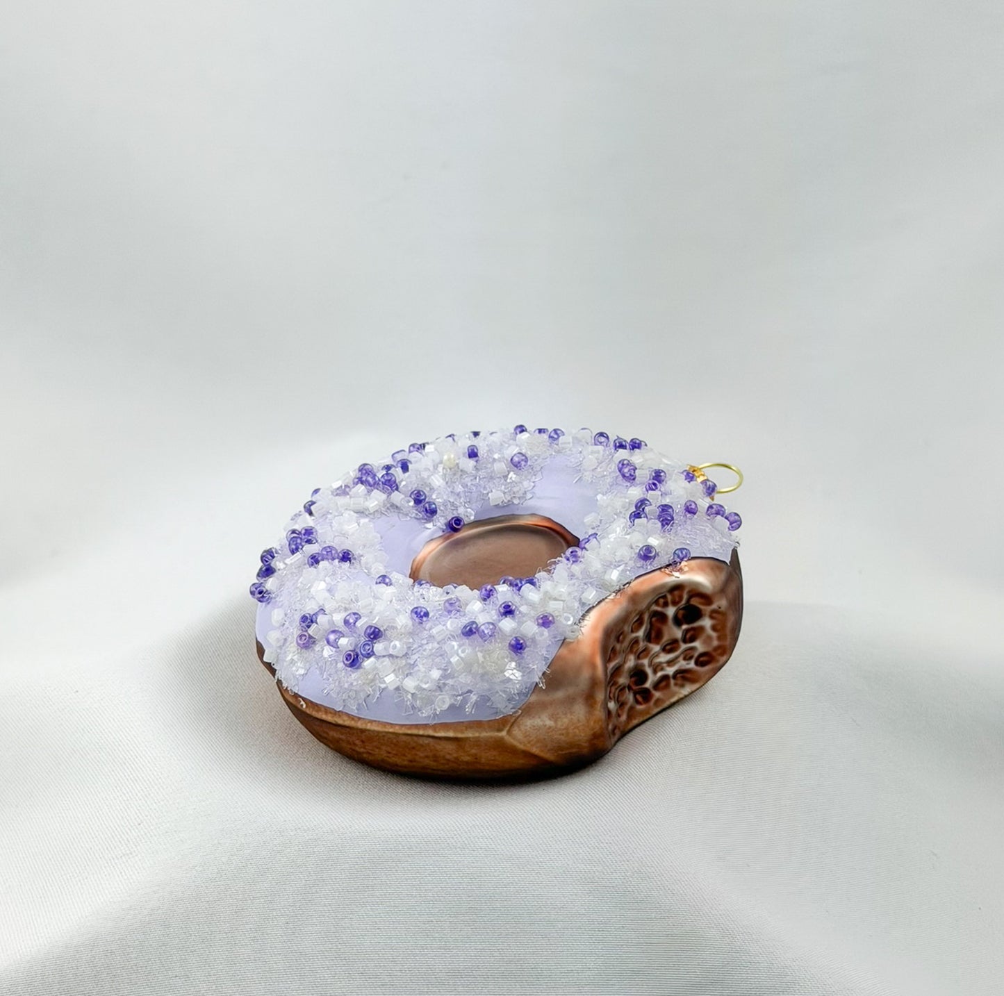 Donut with purple icing and purple sprinkles