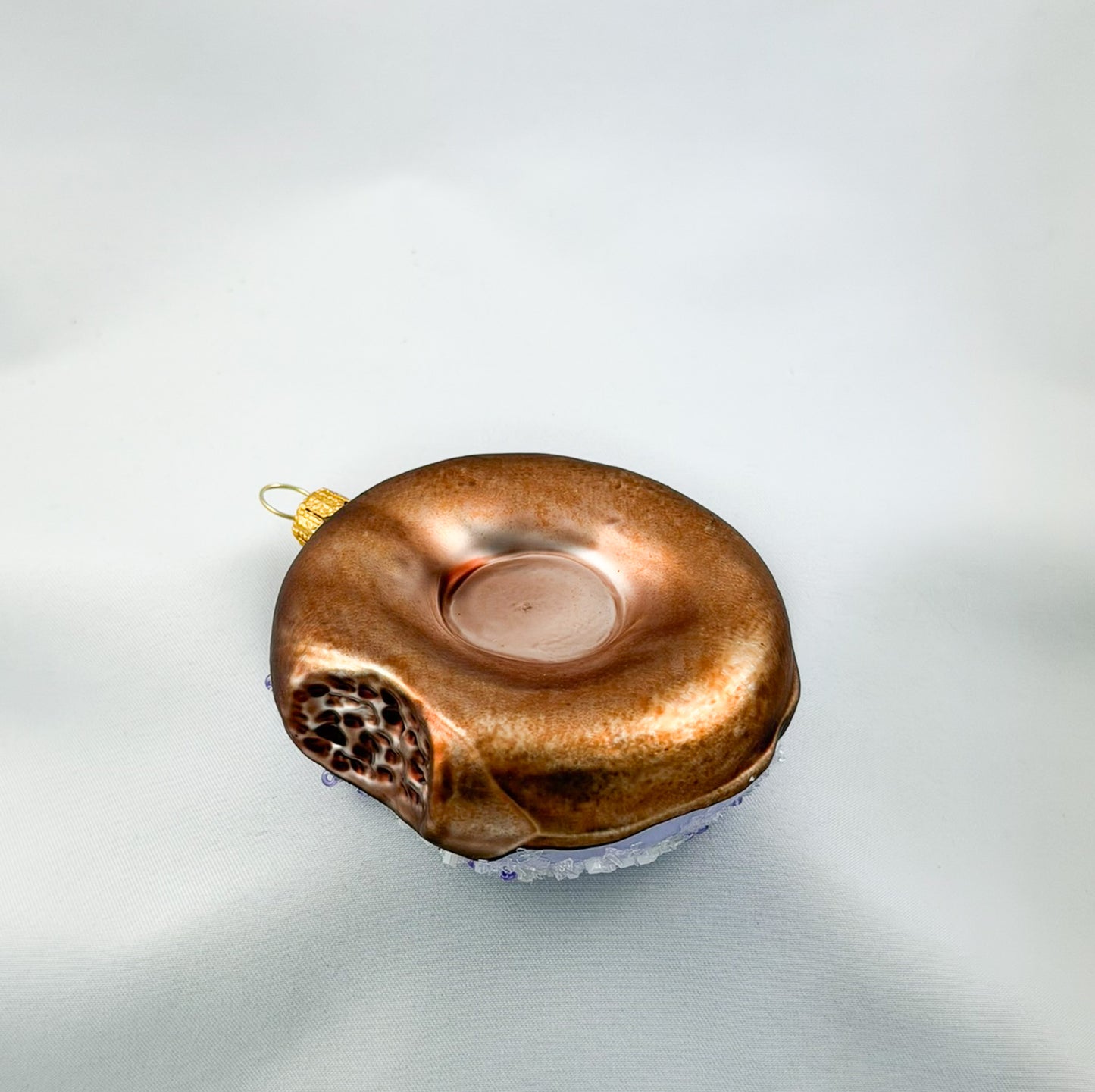Donut with purple icing and purple sprinkles