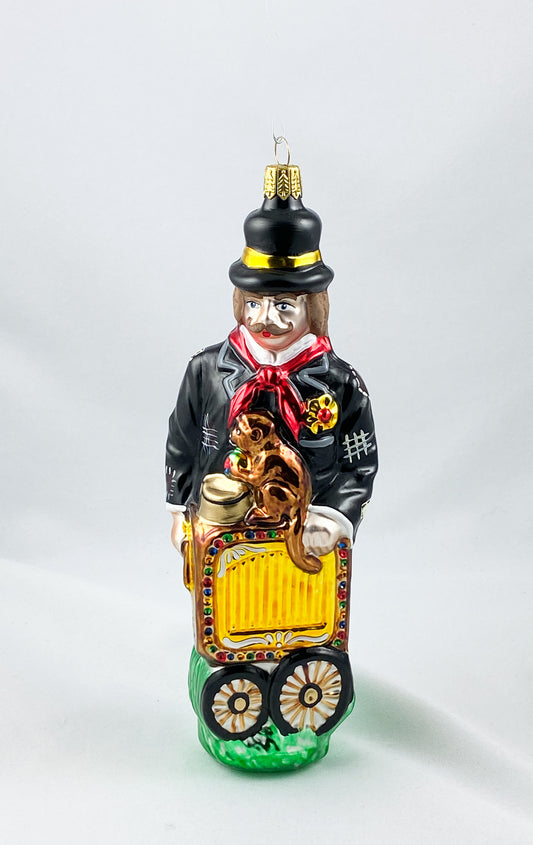 Drehleier -Spieler mit Affe