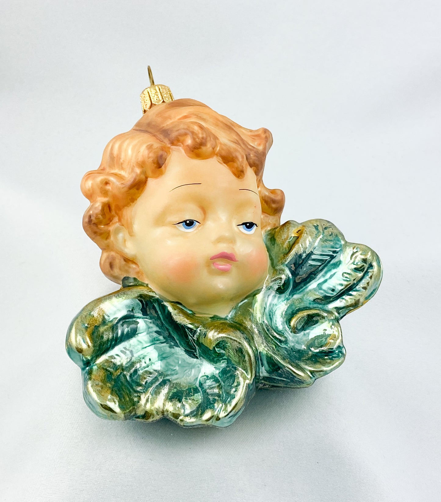 Putto mit grüngoldenen Flügeln, KOMOZJA MOSTOWSKI