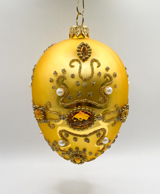 Golden Faberge egg baroque with pearls and golden gemstones