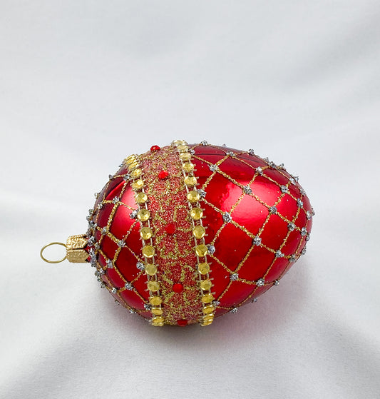 Egg-shaped shiny red with gold brocade decoration