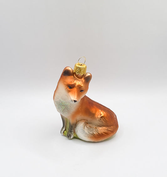 Sitting mischievous fox