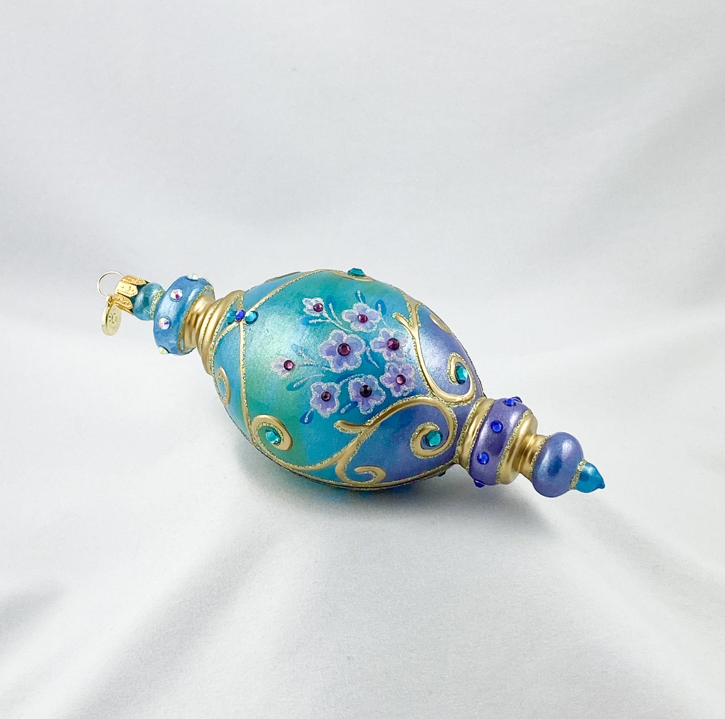 Oval drop shape in turquoise with pink flowers and glitter stones, GlitterLab