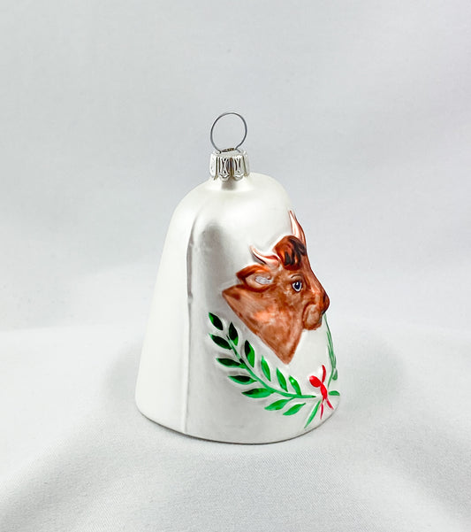 White bell with brown cow