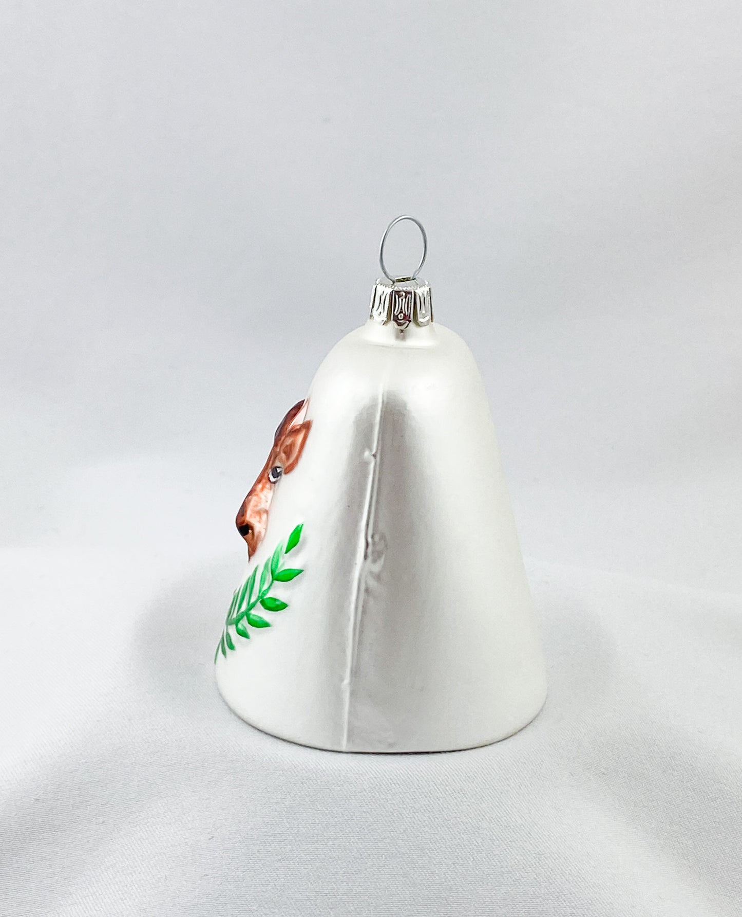 White bell with brown cow