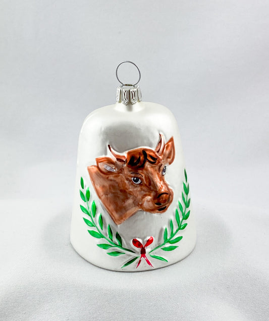 White bell with brown cow
