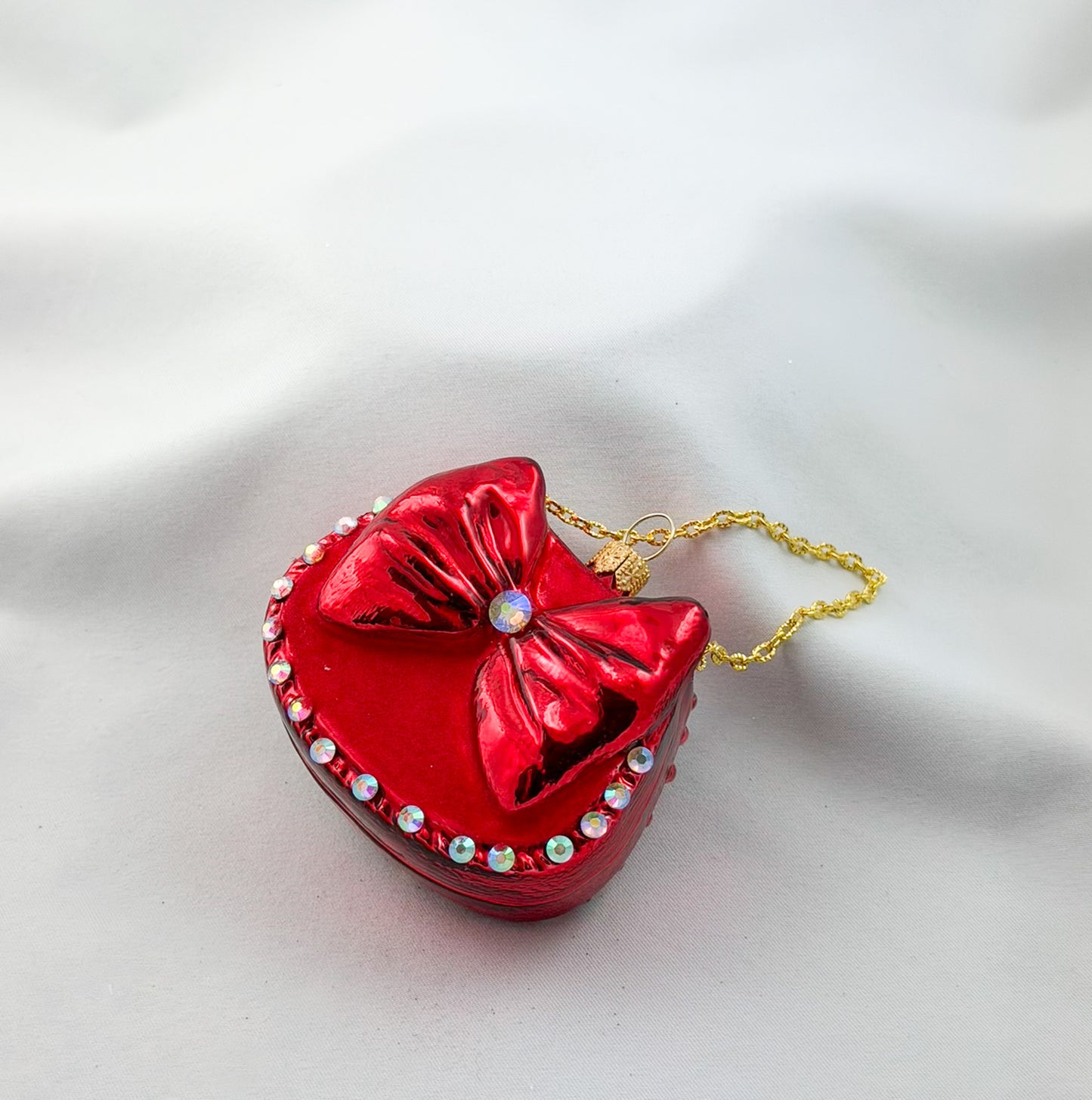 Red women's handbag with bow and glitter stones