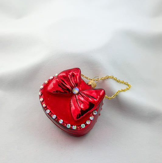 Red women's handbag with bow and glitter stones
