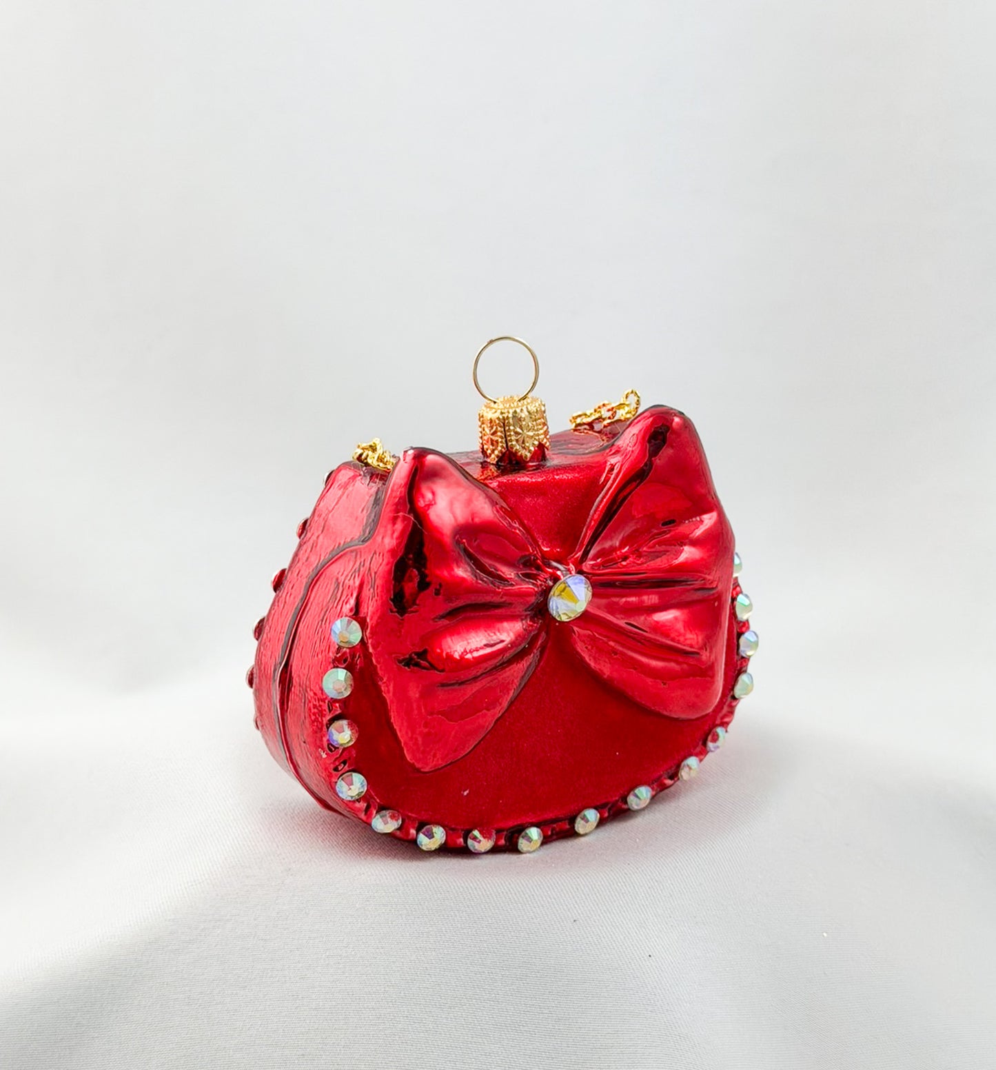Red women's handbag with bow and glitter stones
