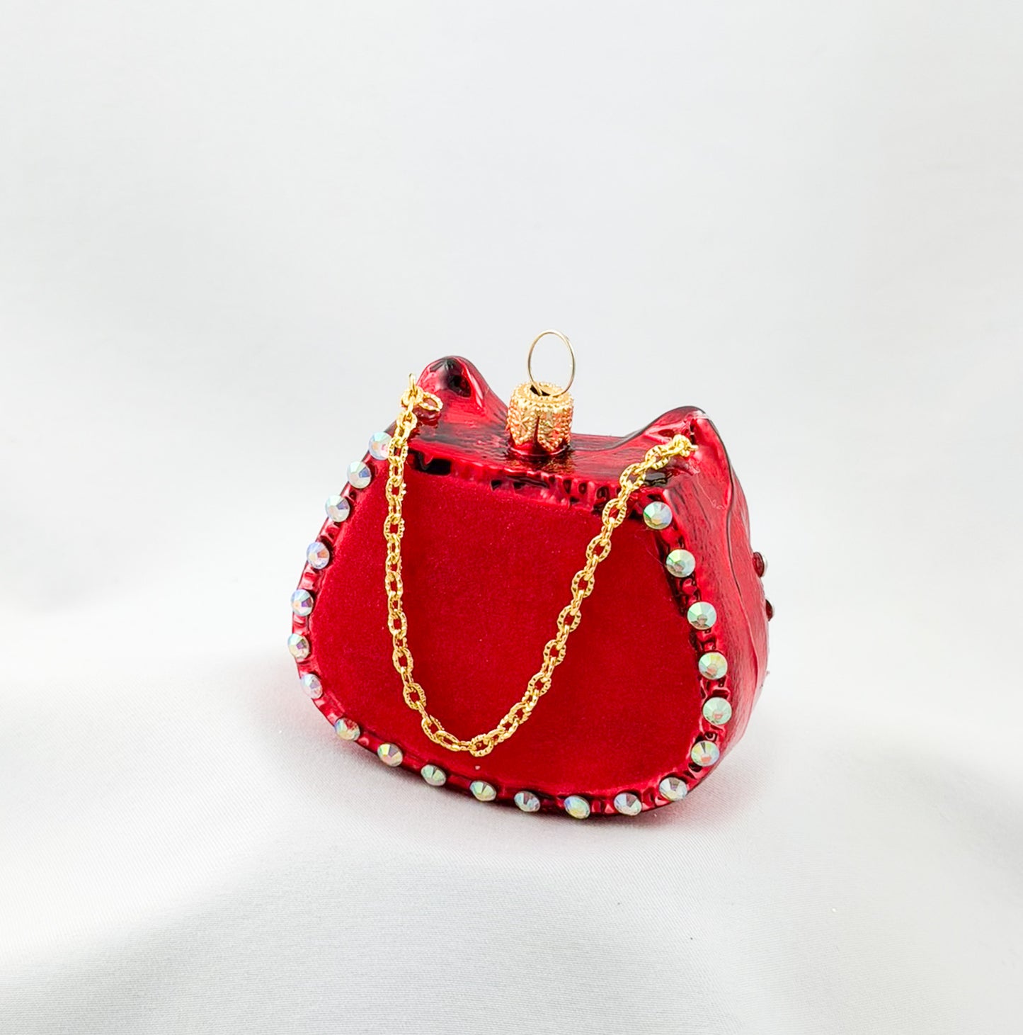 Red women's handbag with bow and glitter stones