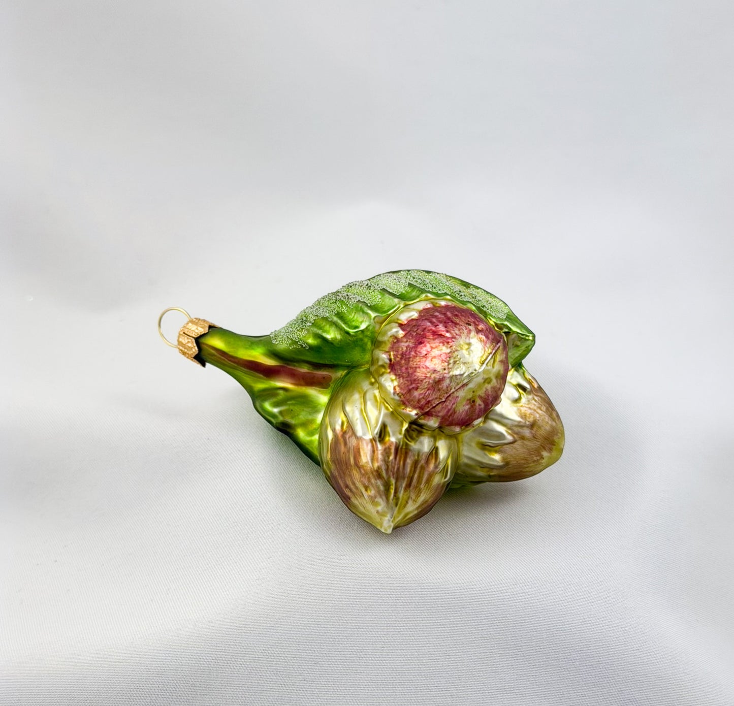 Three hazelnuts on a branch