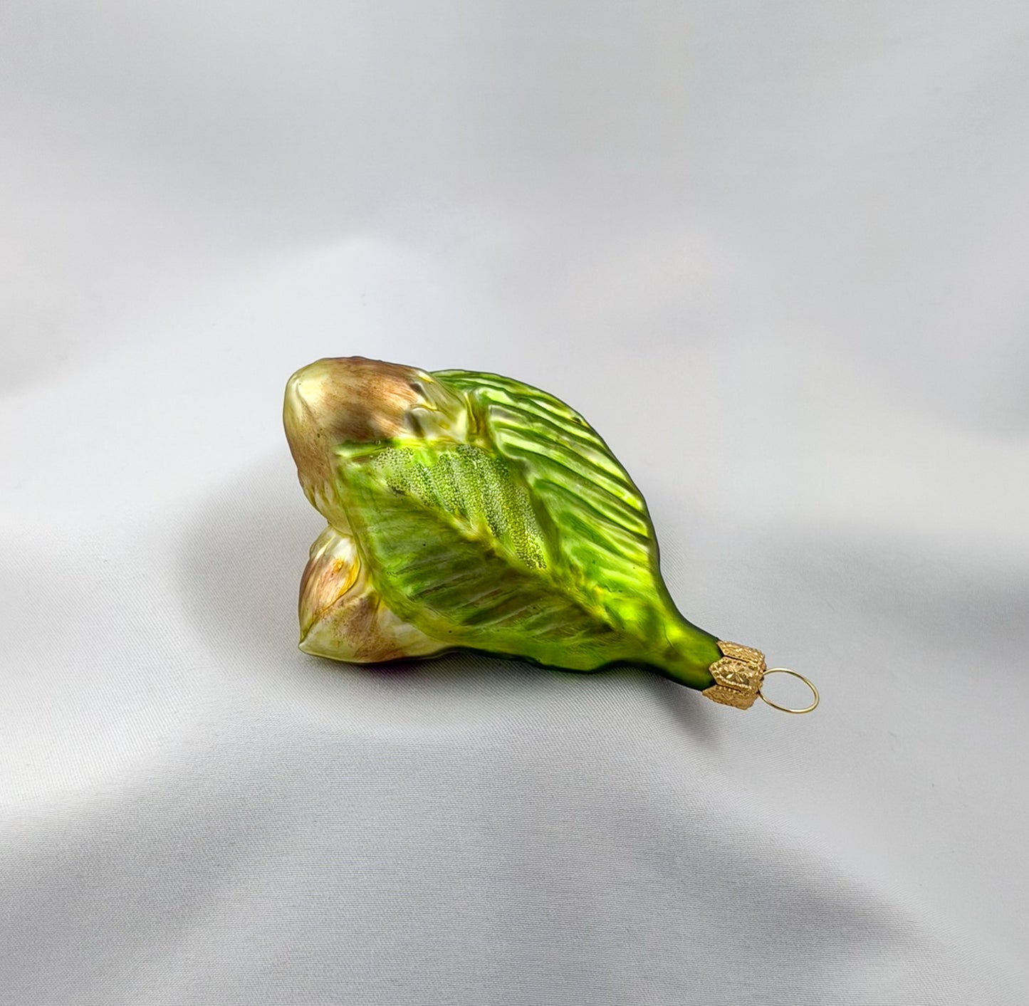 Three hazelnuts on a branch