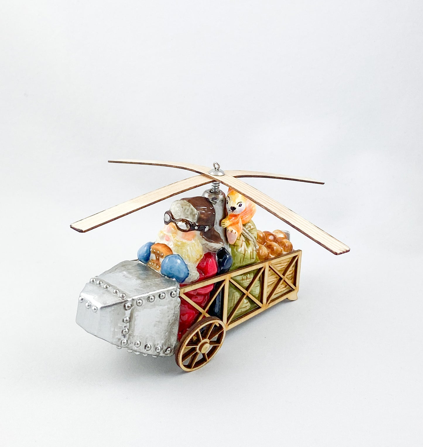 Santa Claus transports the hazelnuts for the squirrel by helicopter AtlasArt
