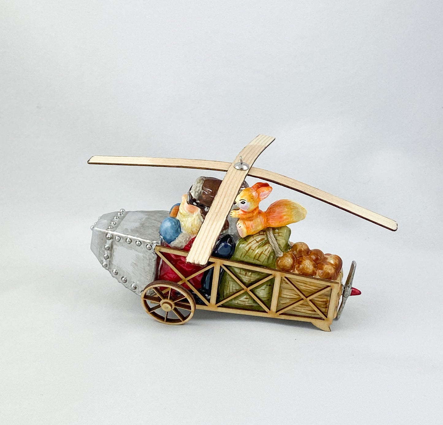 Santa Claus transports the hazelnuts for the squirrel by helicopter AtlasArt