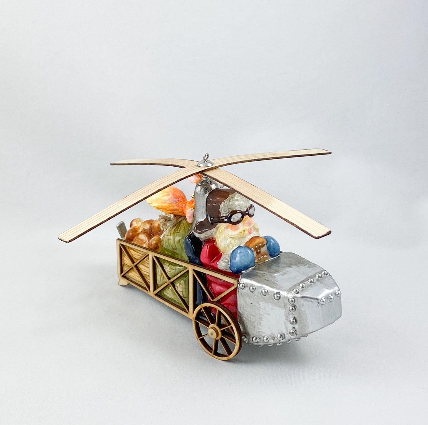 Santa Claus transports the hazelnuts for the squirrel by helicopter AtlasArt