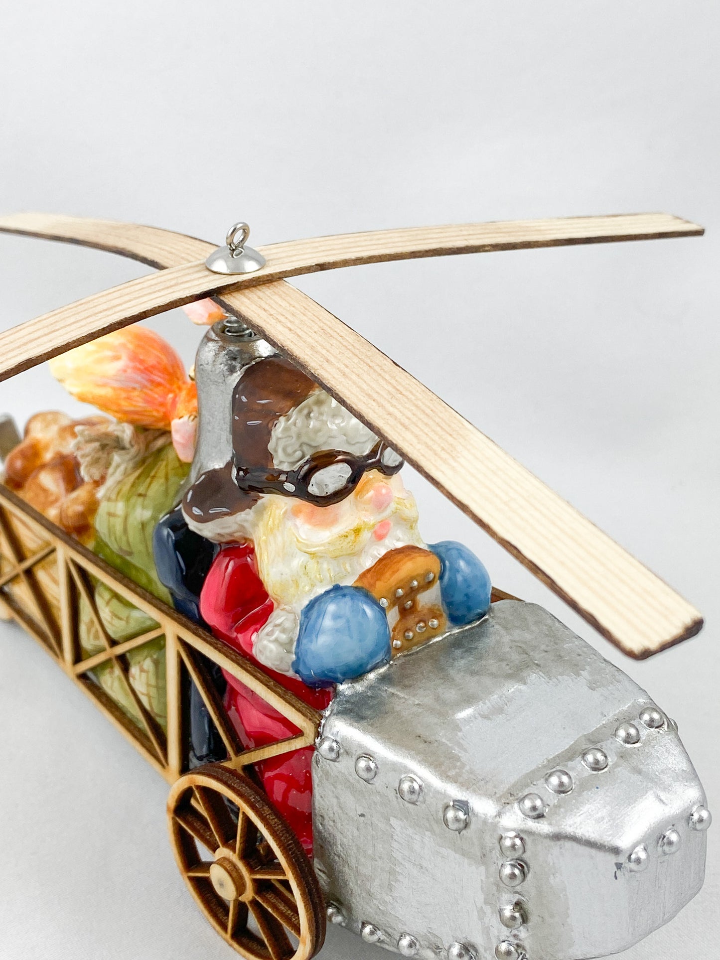 Santa Claus transports the hazelnuts for the squirrel by helicopter AtlasArt