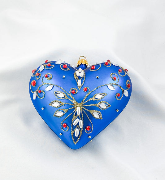 Blue heart with pearls and red gemstones
