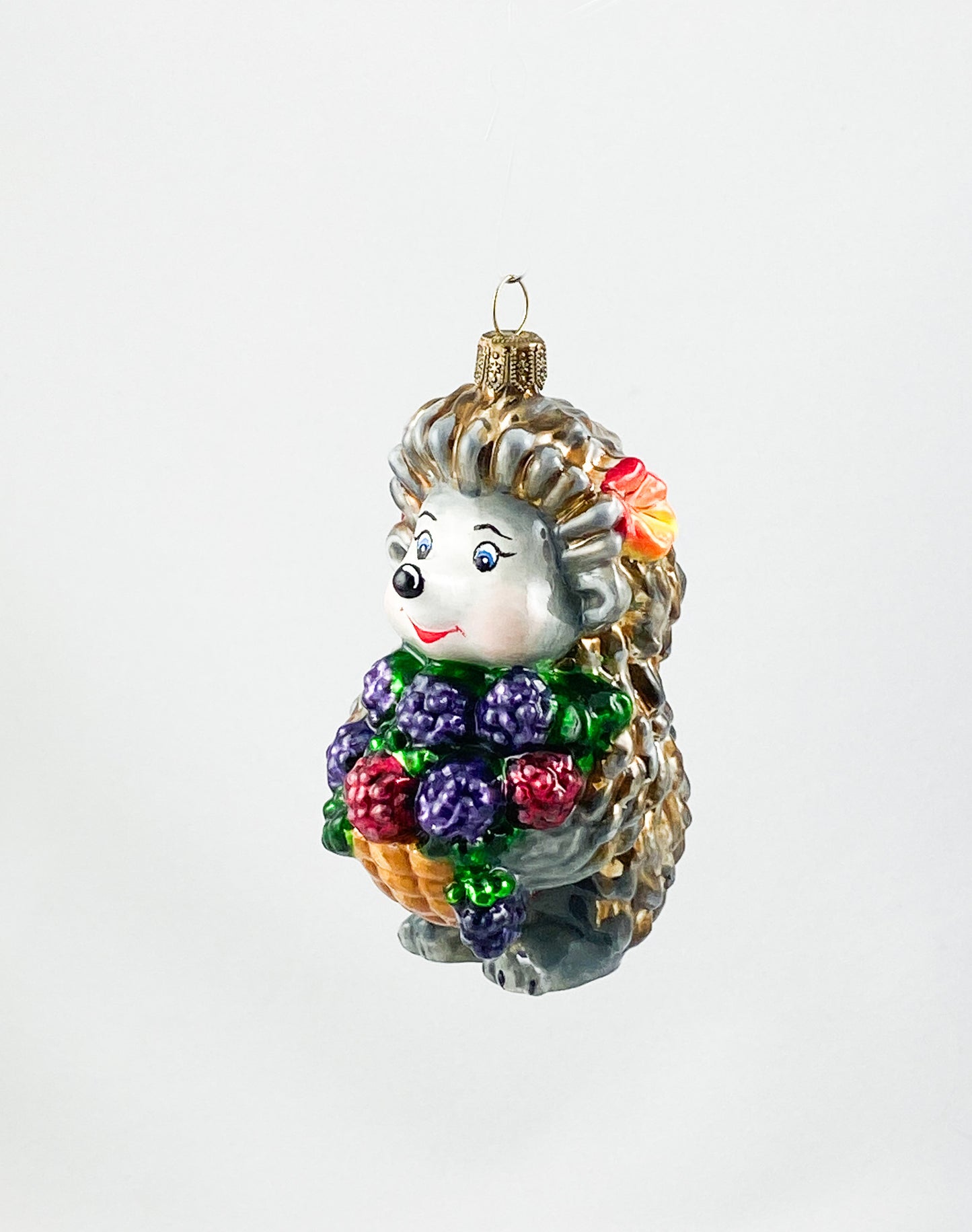 Hedgehog brings a basket full of blackberries AtlasArt