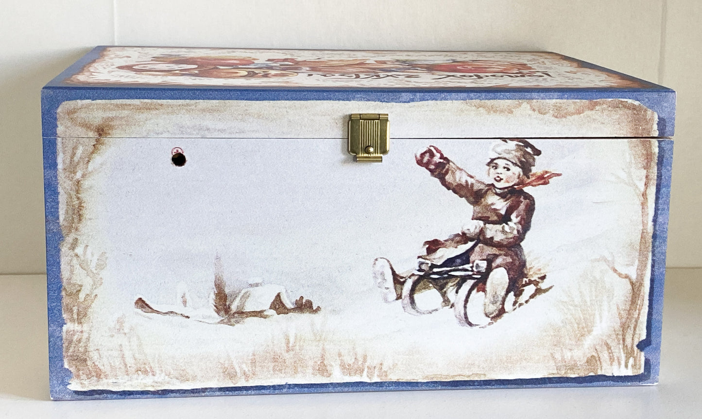 Two children in a hedgehog sleigh, set of 2, in a wooden box