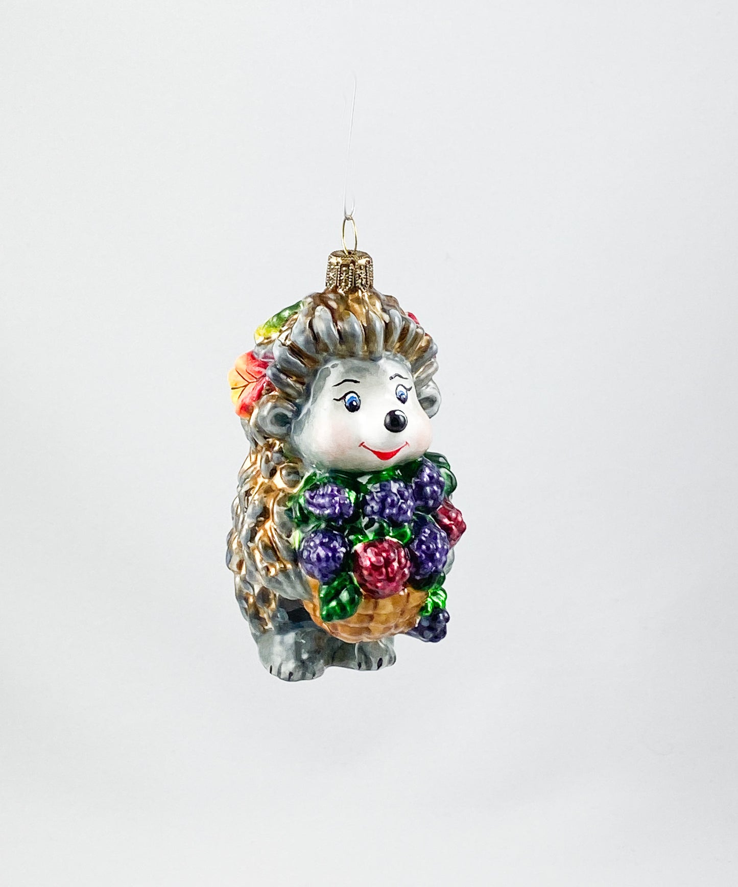 Hedgehog brings a basket full of blackberries AtlasArt