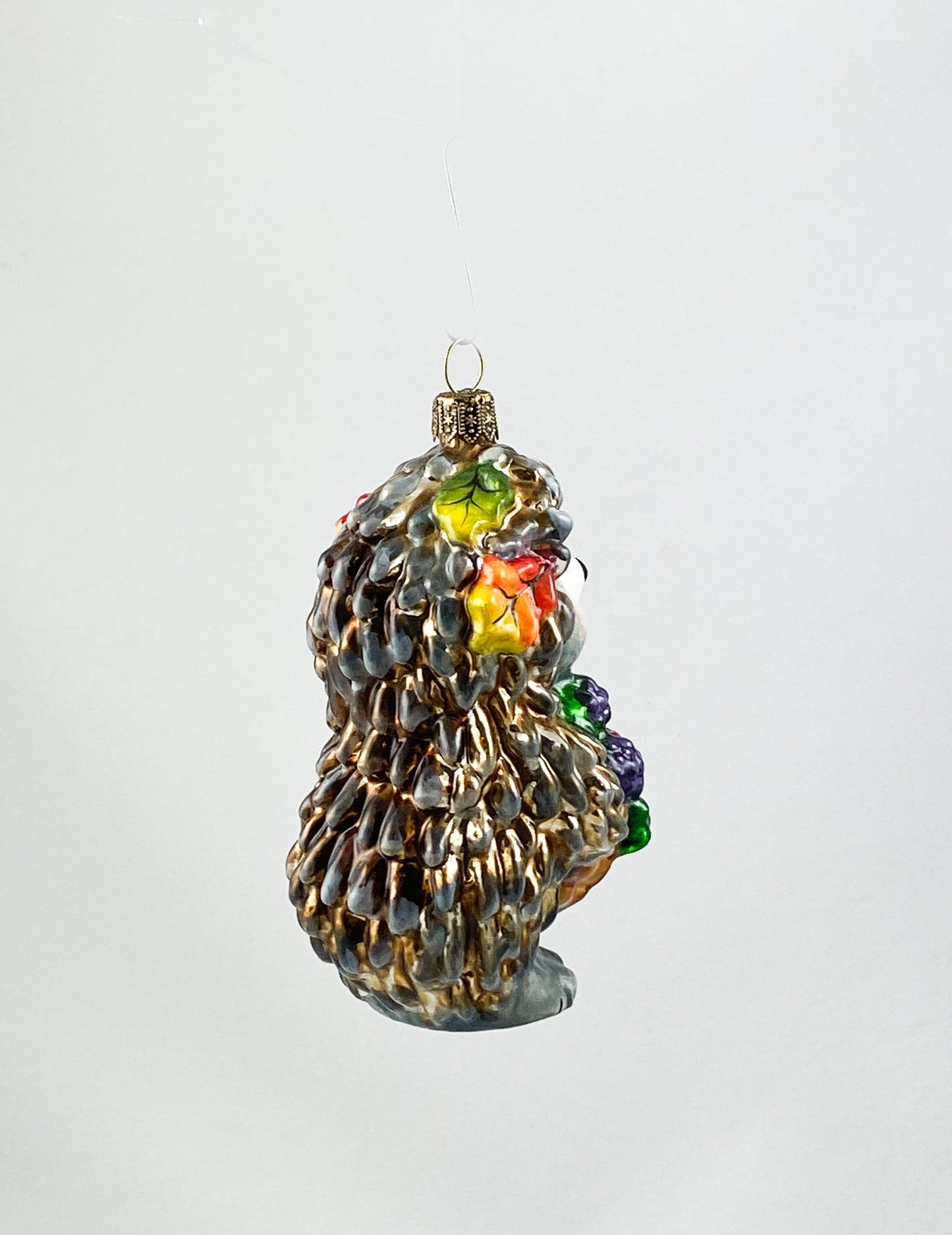 Hedgehog brings a basket full of blackberries AtlasArt