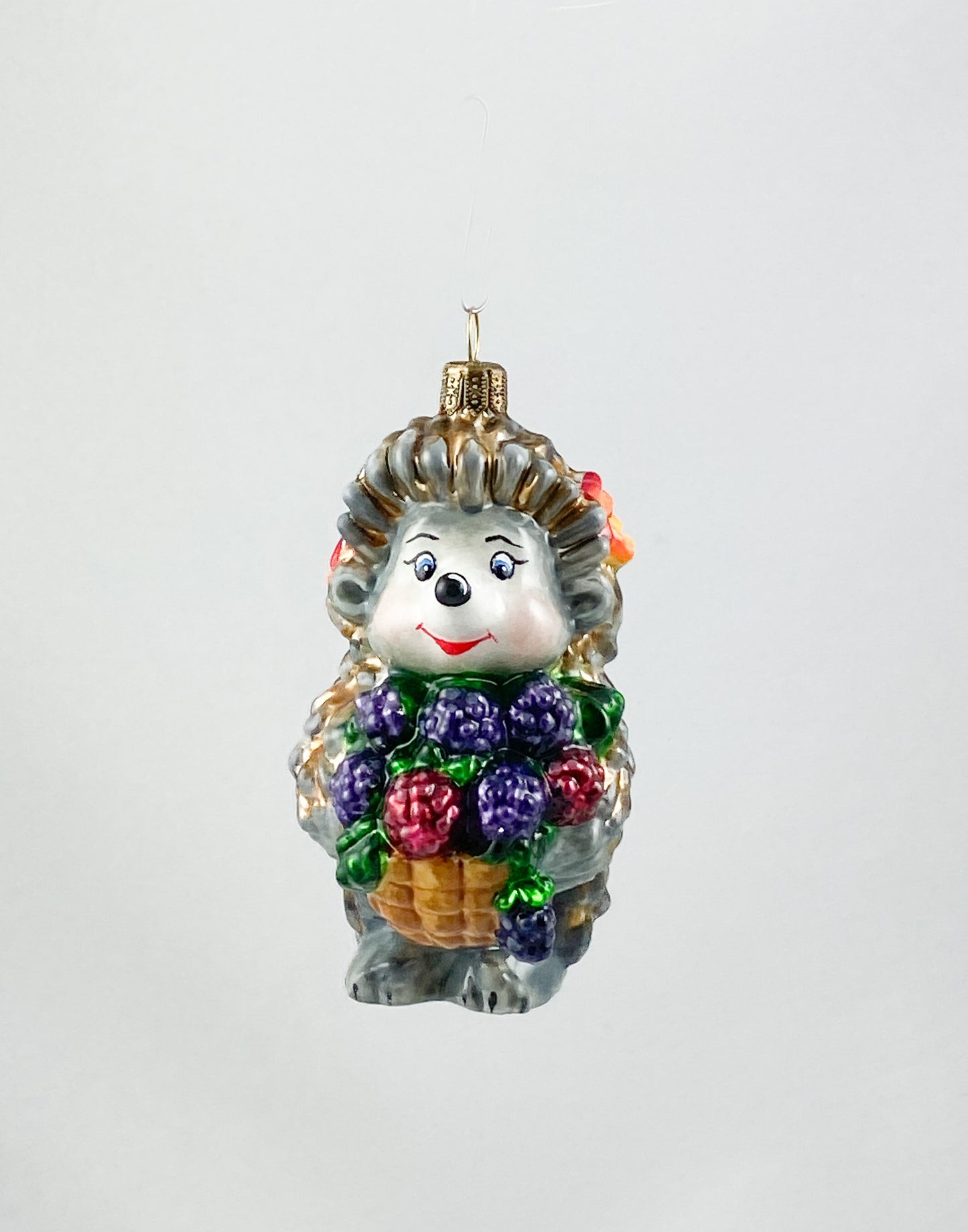 Hedgehog brings a basket full of blackberries AtlasArt