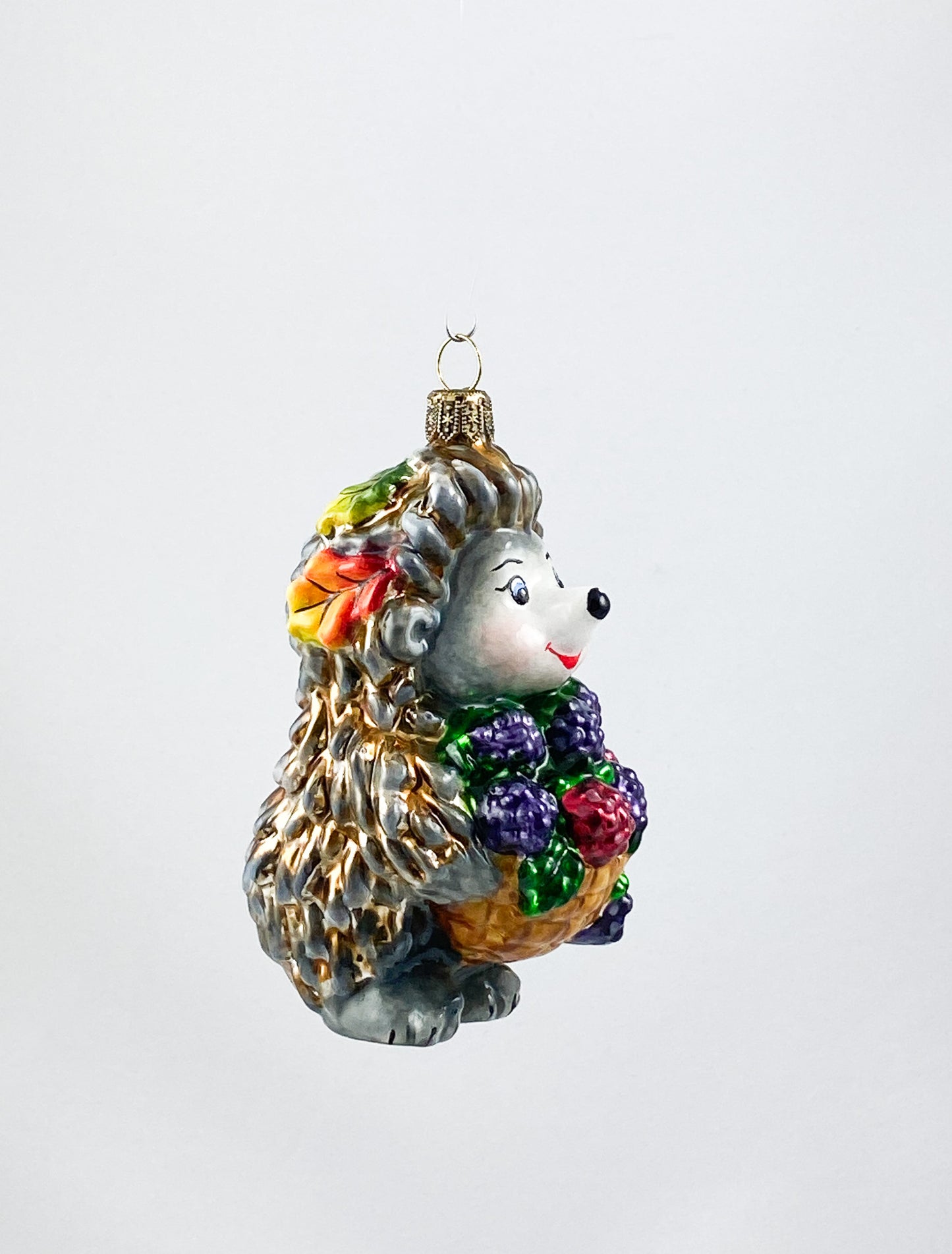 Hedgehog brings a basket full of blackberries AtlasArt