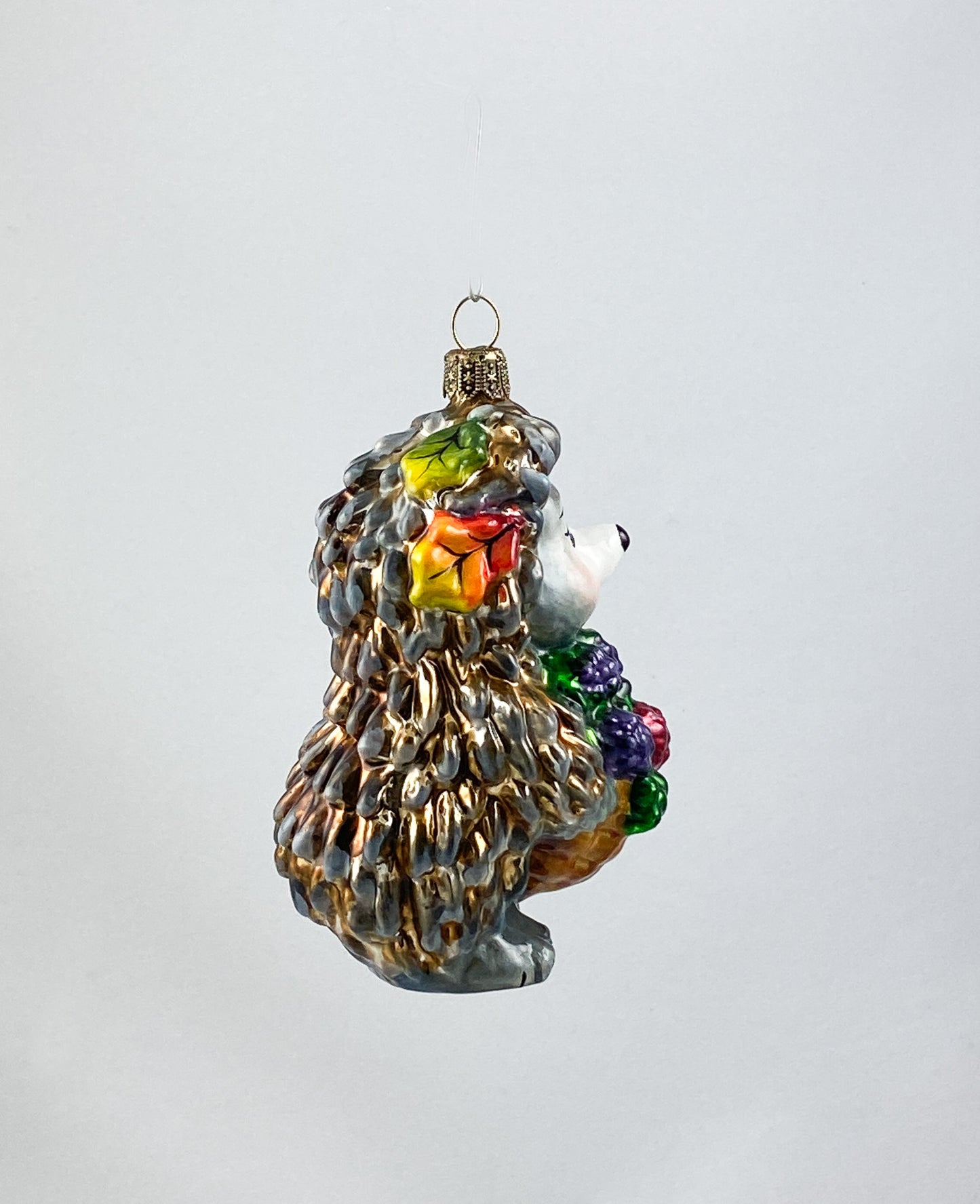 Hedgehog brings a basket full of blackberries AtlasArt