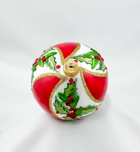 White red diagonally striped ball with holly decoration