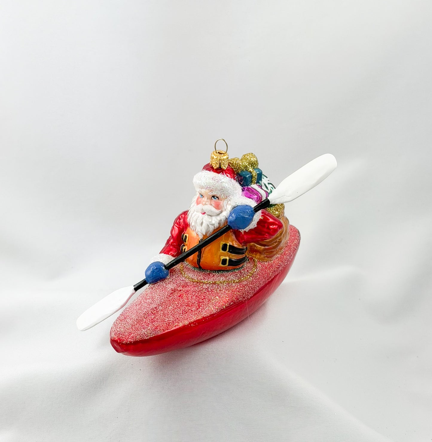 Santa Claus brings the presents by kayak