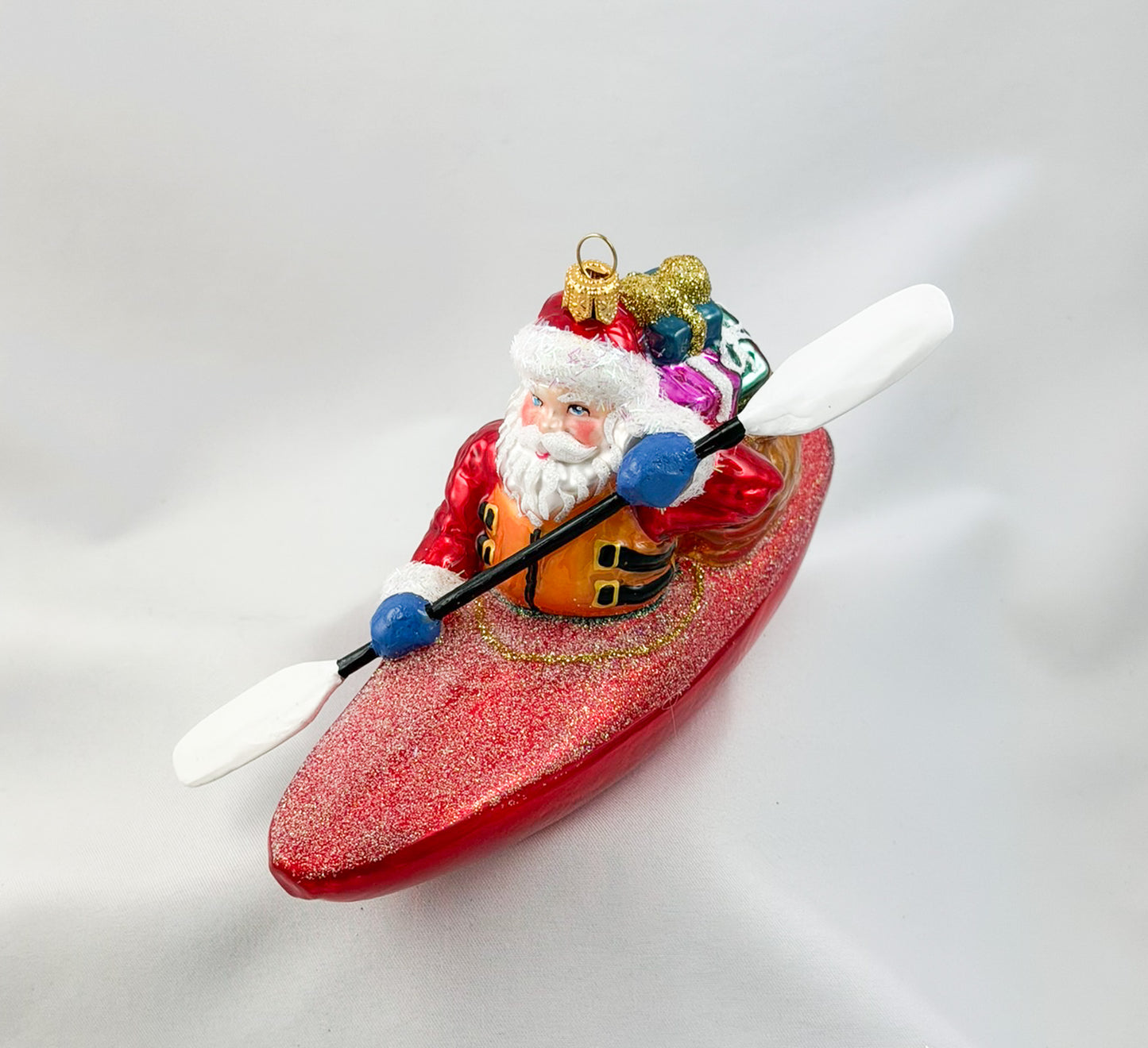 Santa Claus brings the presents by kayak