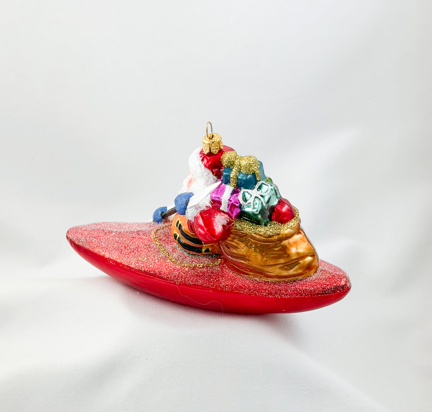 Santa Claus brings the presents by kayak