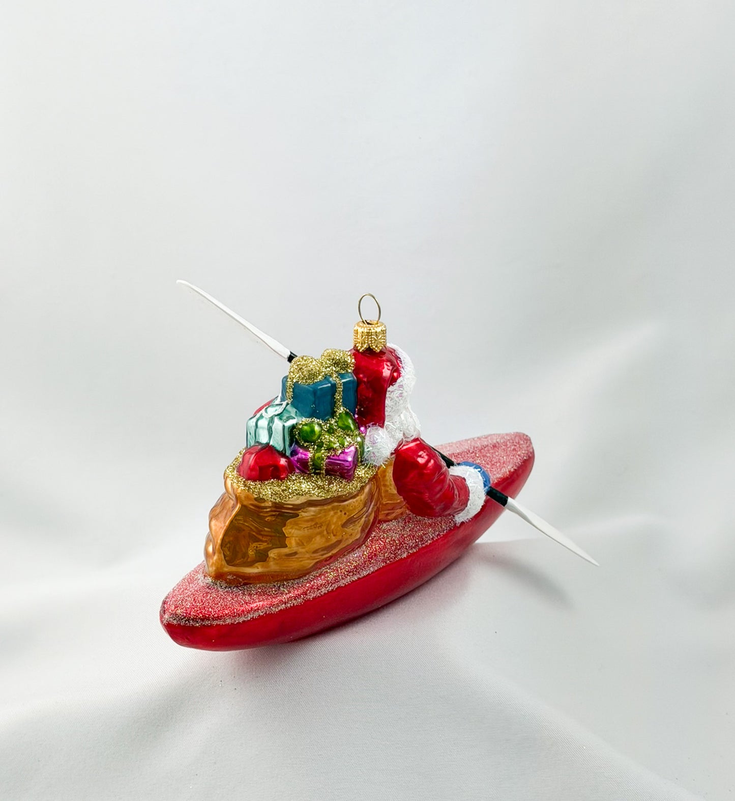 Santa Claus brings the presents by kayak