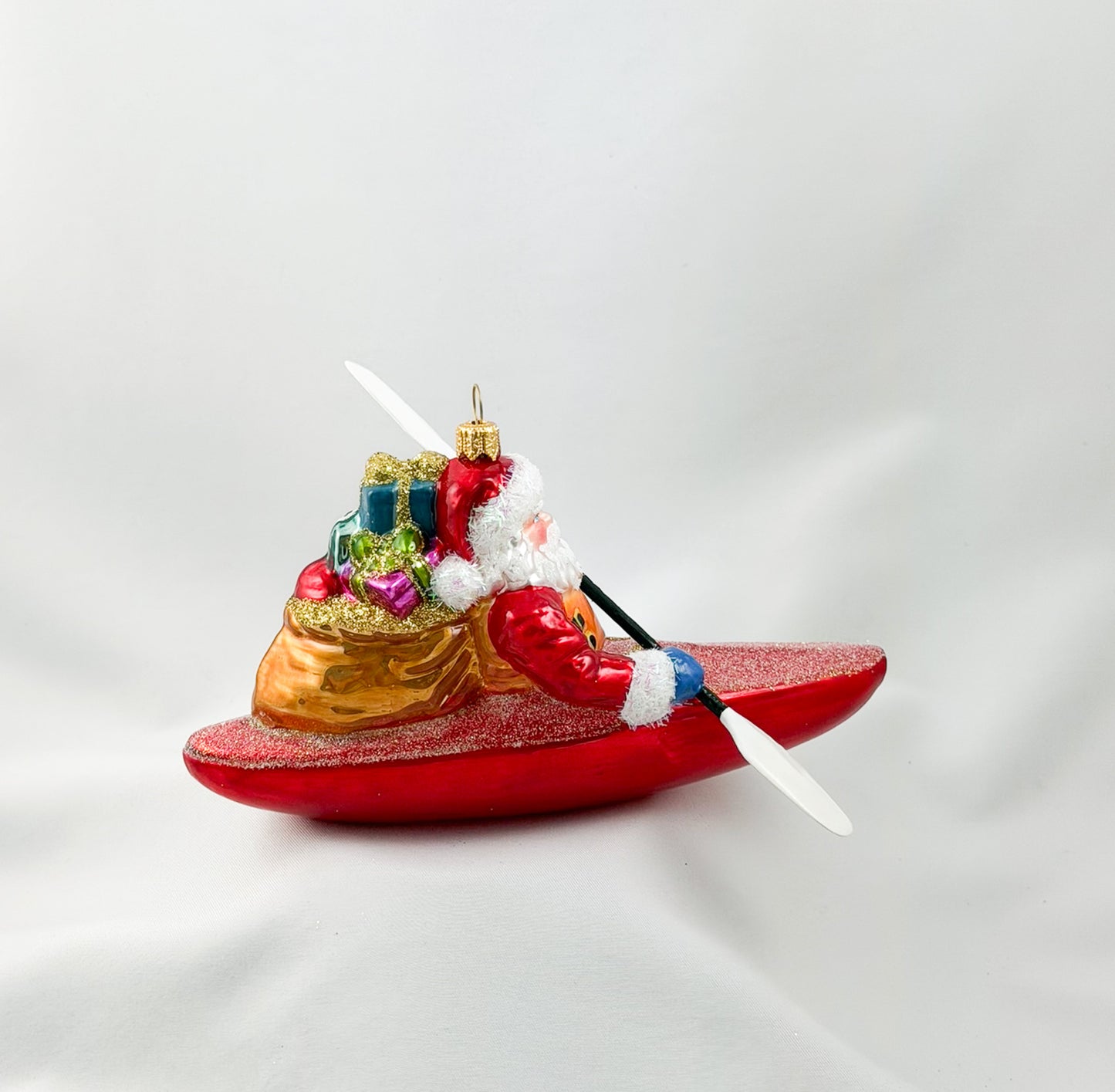 Santa Claus brings the presents by kayak