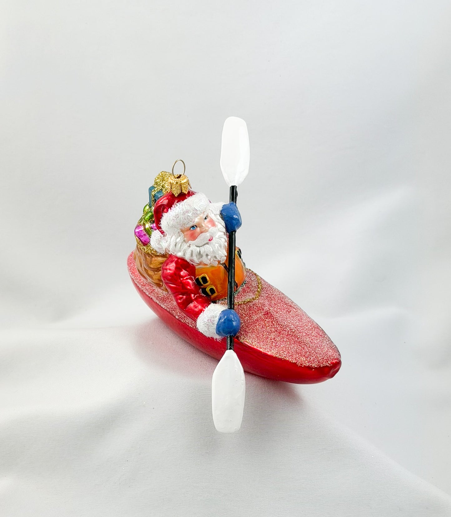 Santa Claus brings the presents by kayak