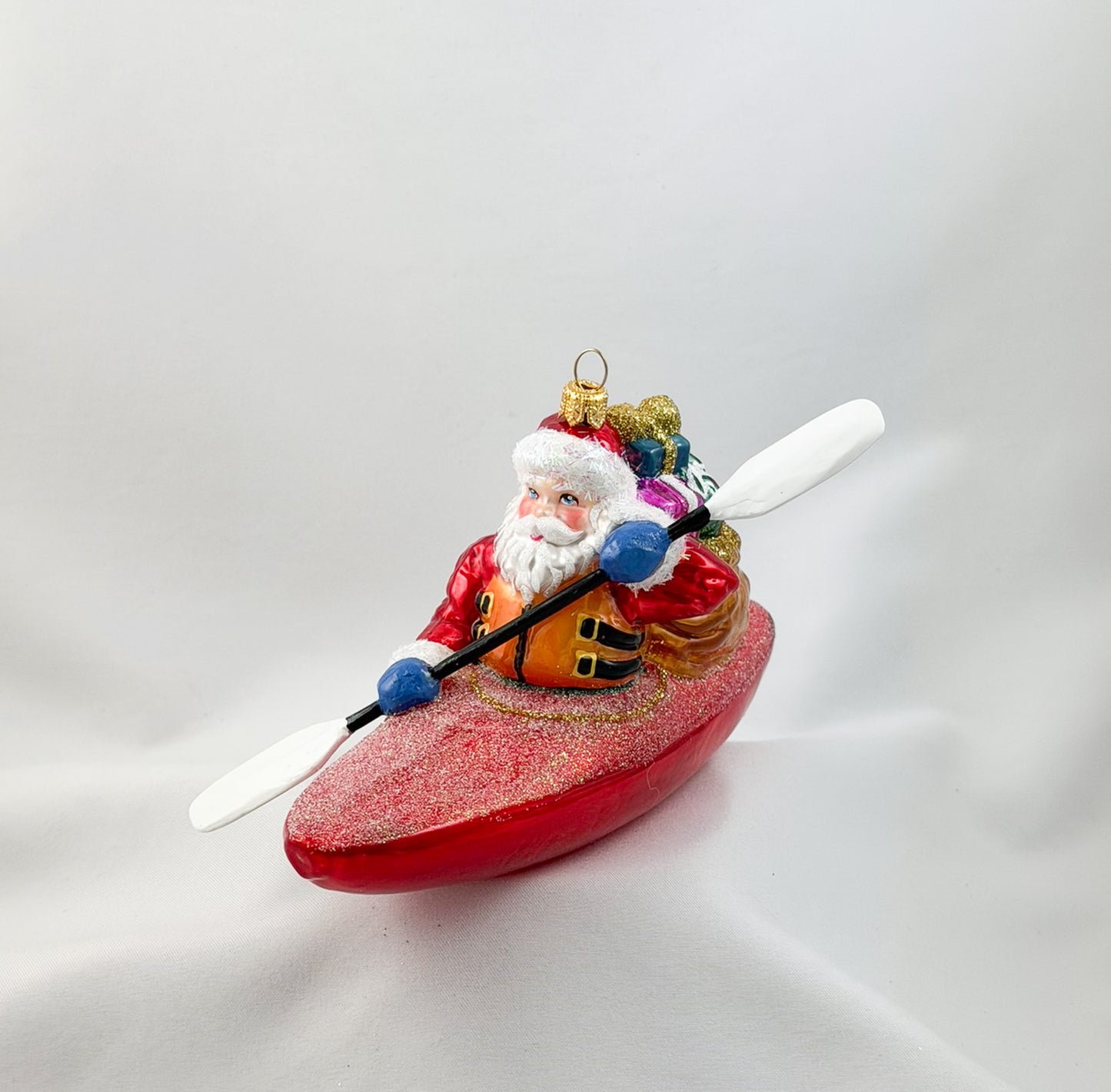Santa Claus brings the presents by kayak