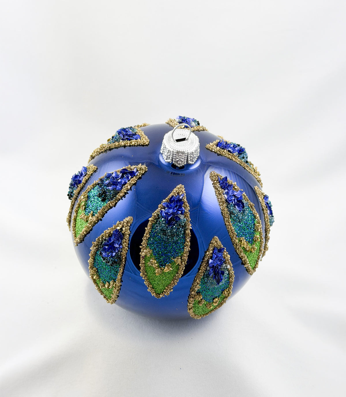 Kugel gross blau mit Blättern im Pfauenfeder-Motiv