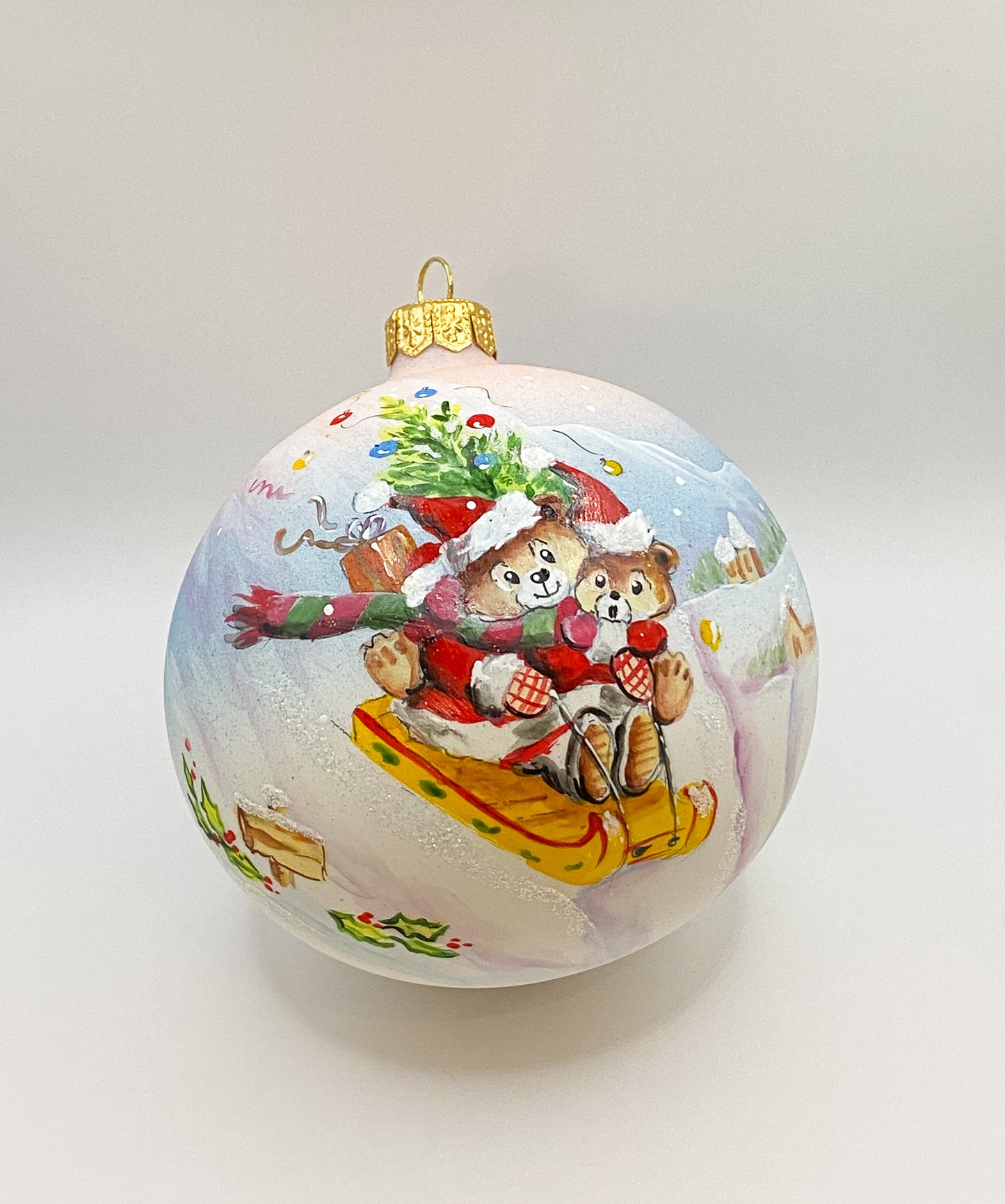 Ball two bears ride sleigh