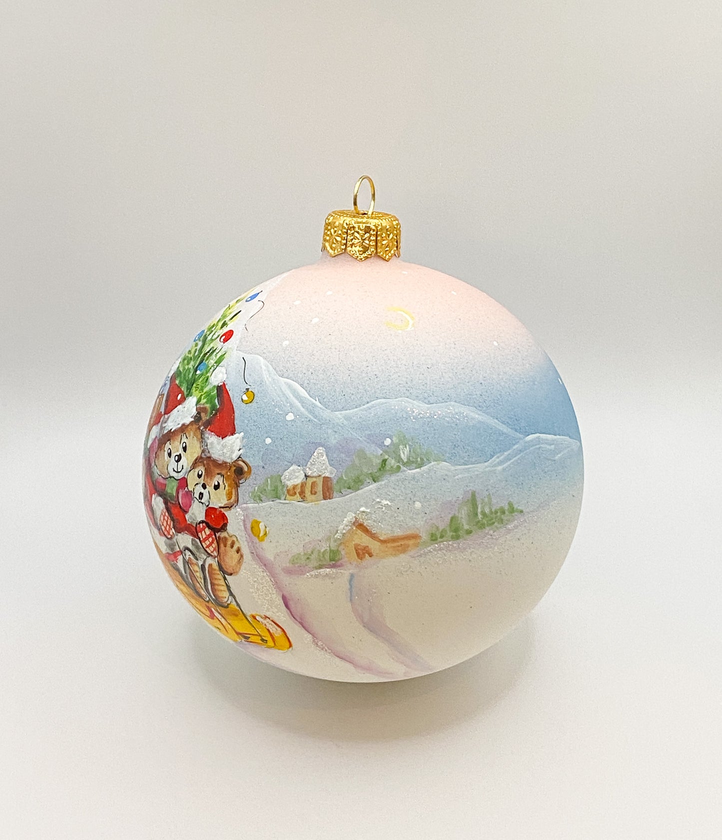 Ball two bears ride sleigh