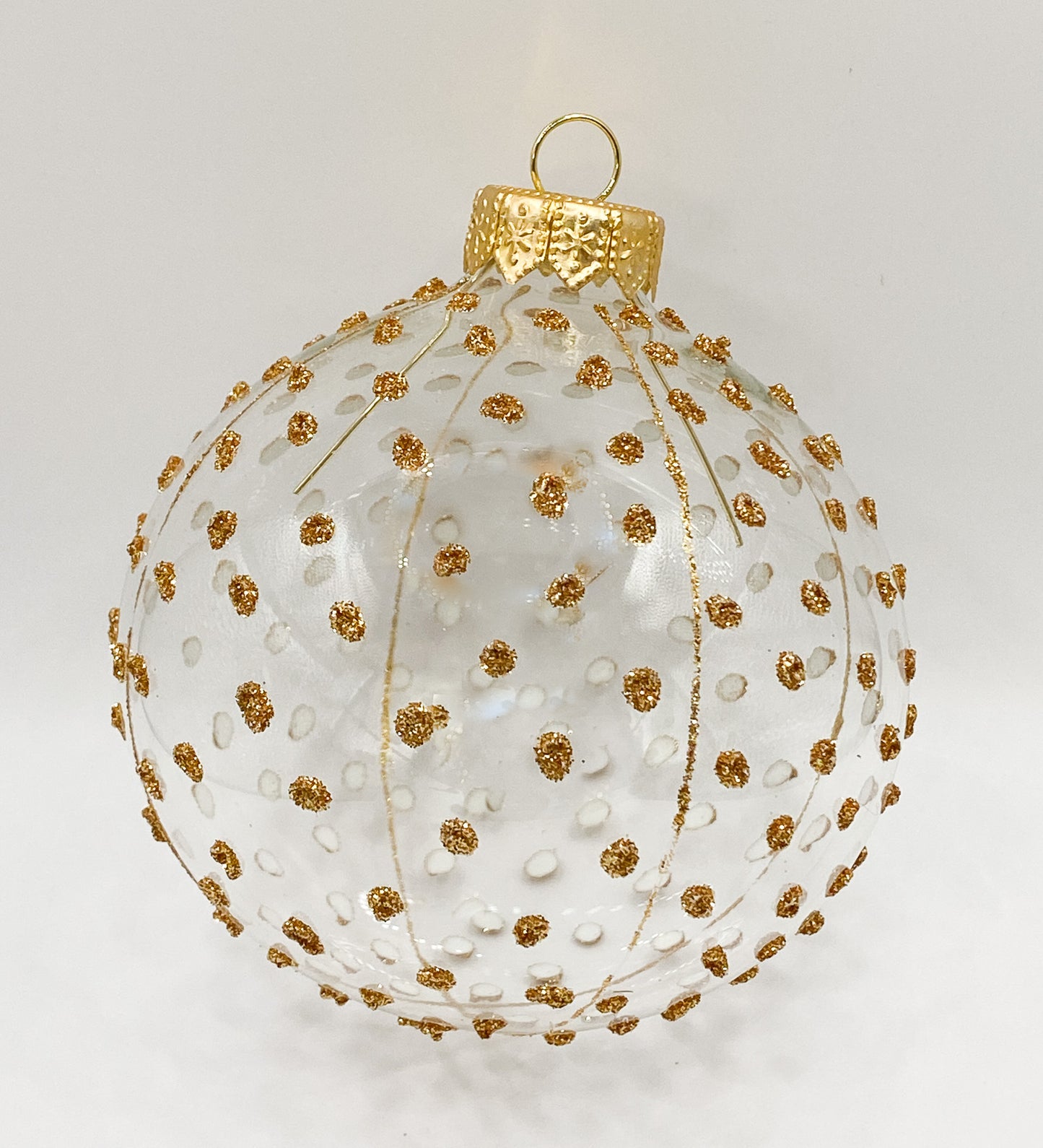 Transparent ball with golden glitter dots