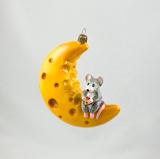 The mouse has made itself comfortable with a piece of cheese on the cheese crescent moon AtlasArt