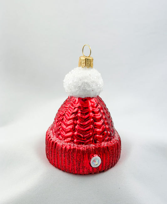 Red knitted hat with white pompom
