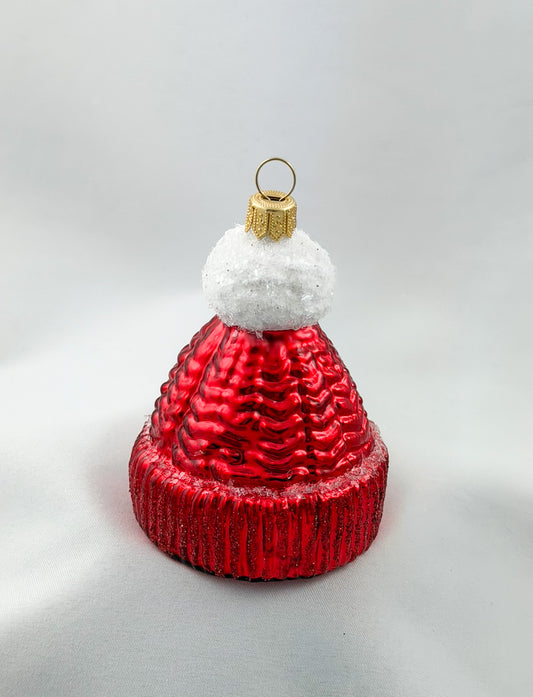 Red knitted hat with white pompom