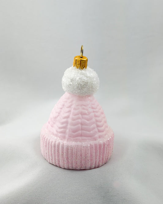 Pink knit beanie with white pompom