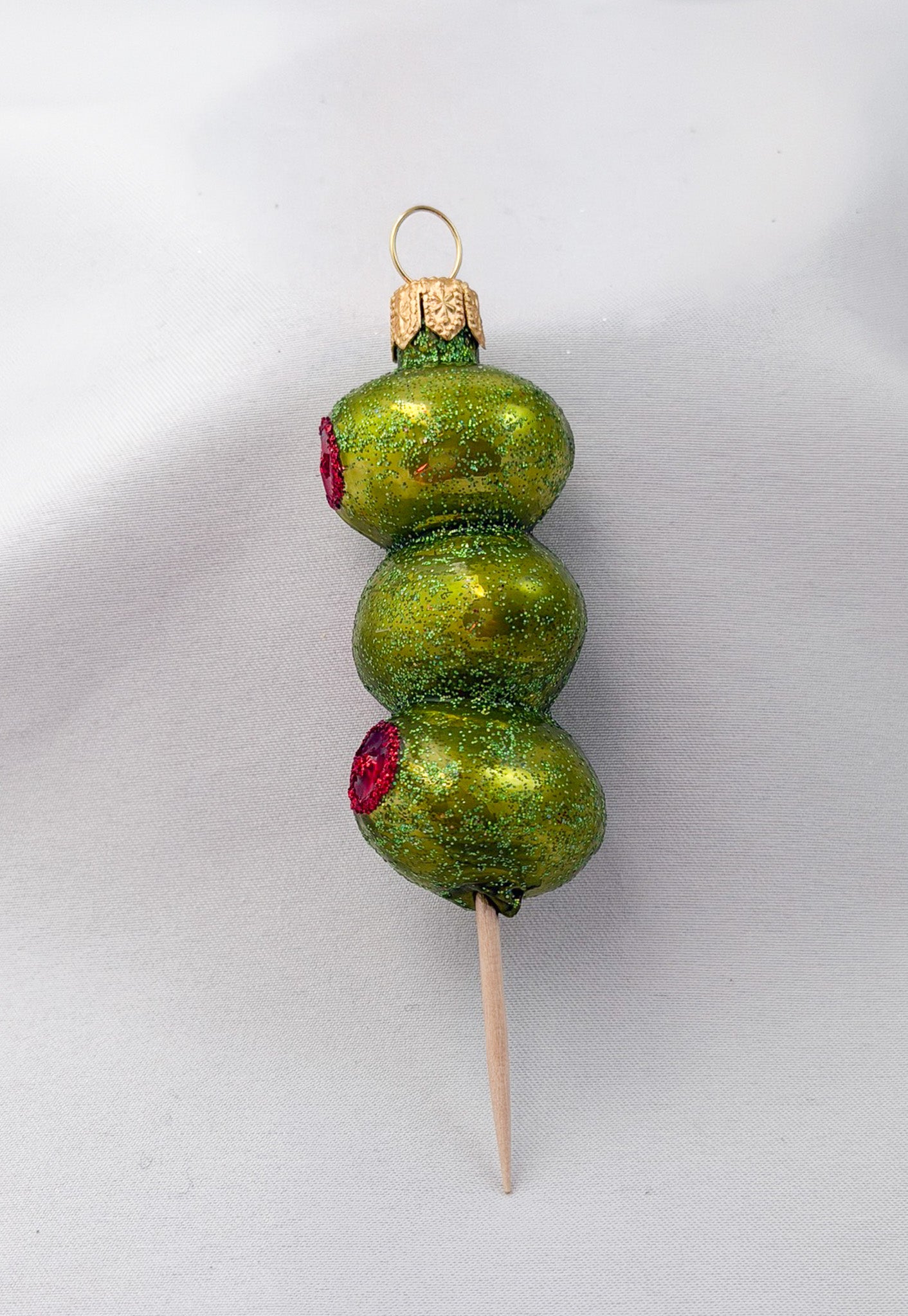 Party nibbles - skewers of stuffed green olives
