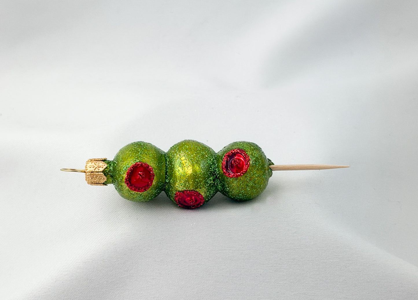 Party nibbles - skewers of stuffed green olives
