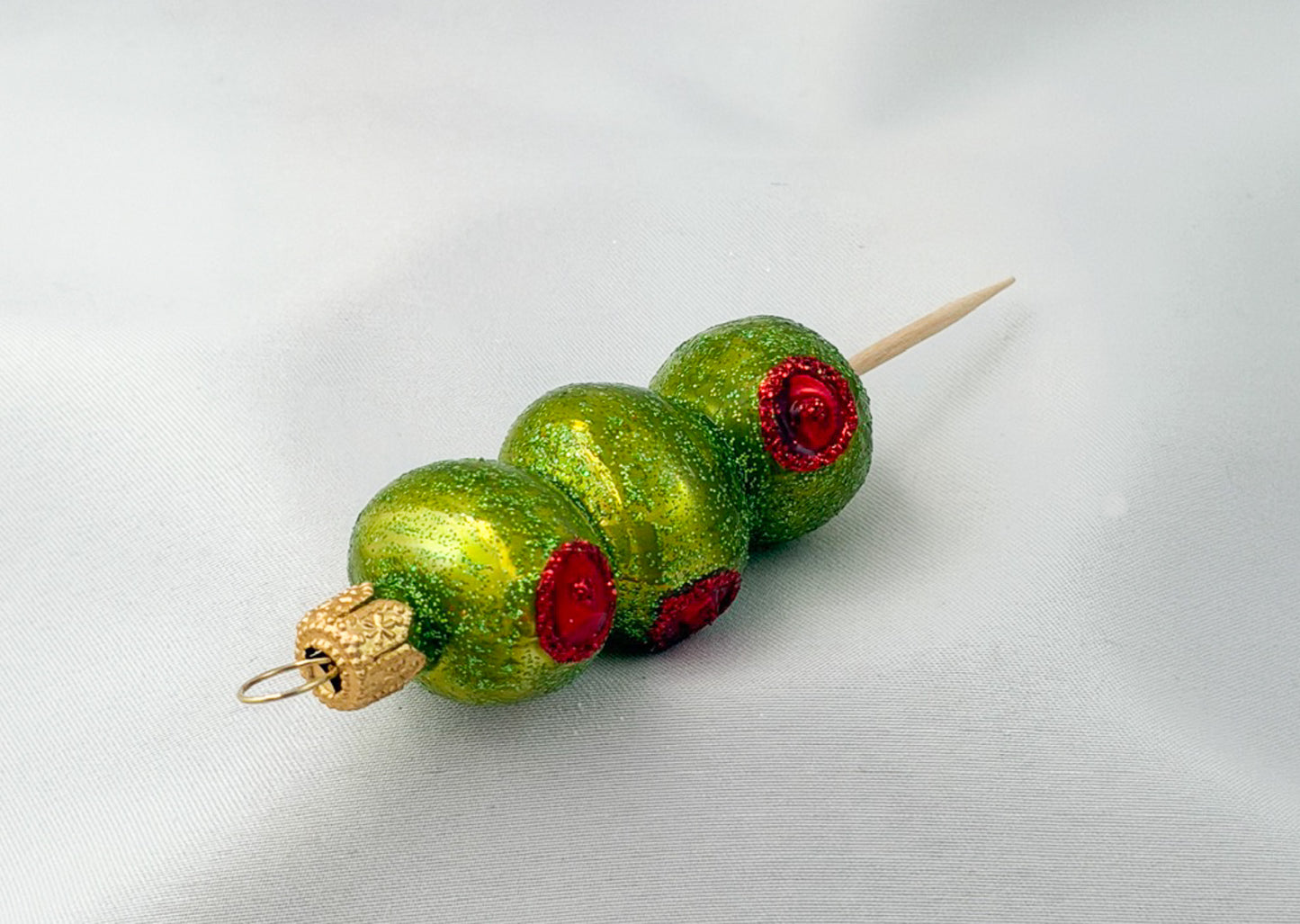 Party nibbles - skewers of stuffed green olives