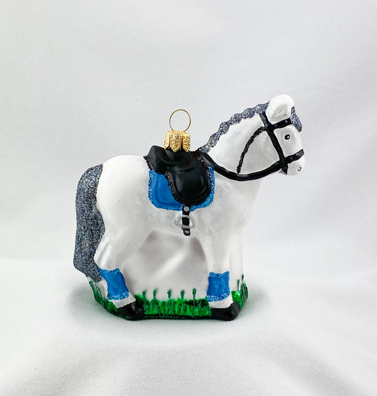 White horse with blue saddlecloth